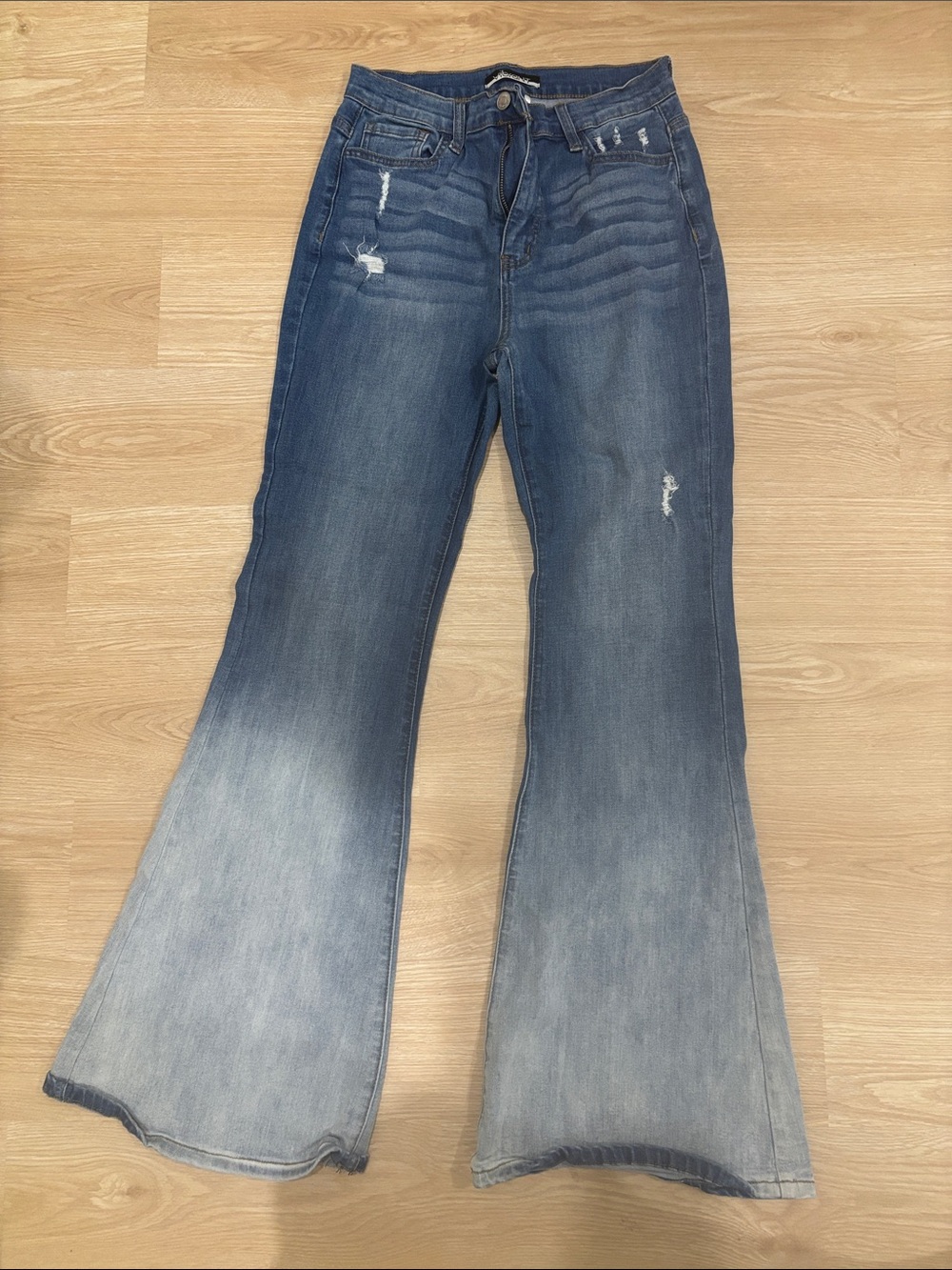 Vibrant Faded Blue Flared Distressed Jeans